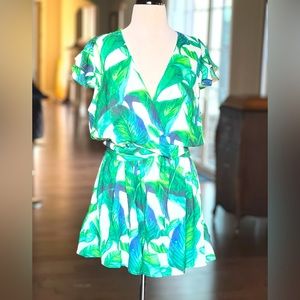 NWOT ruffle romper, wrap style that crosses chest and ties in back. Small